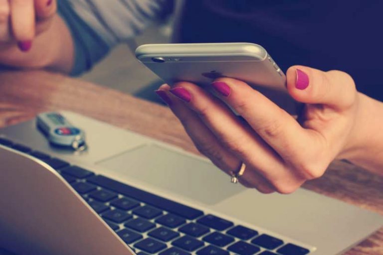 Student Holding phone for Assistive Technology