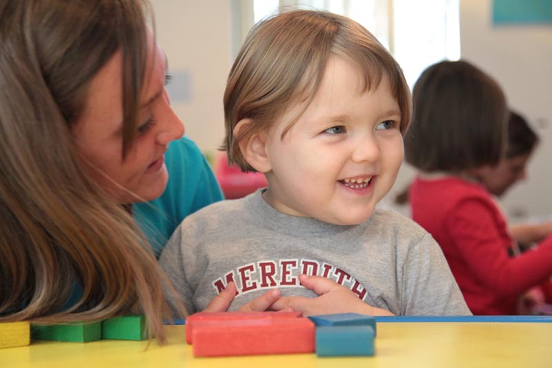 Meredith Student and Autism Student in Lab.