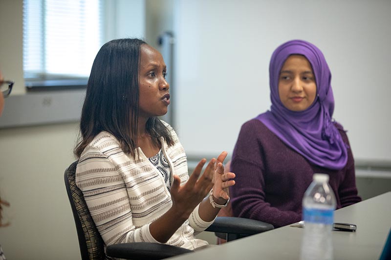 Two students in a class discussion.