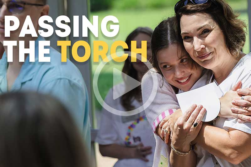 Meredith Student and mother embrace during a Legacy Pinning Ceremony.