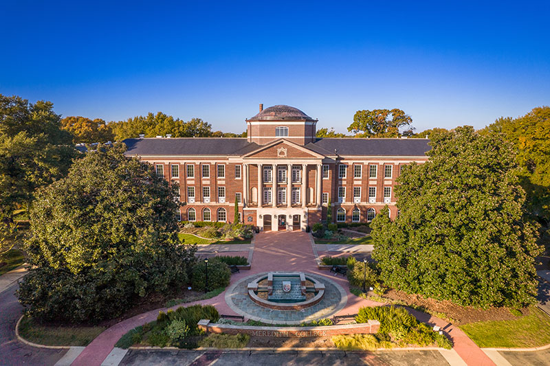 Johnson Hall and Front Fountain with surrounding trees