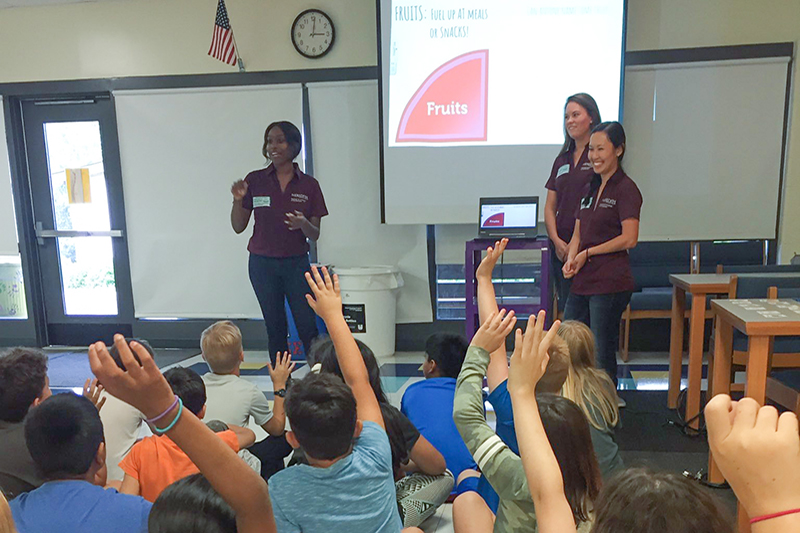 Nutritionists speaking to students.