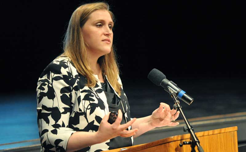 person presenting at podium